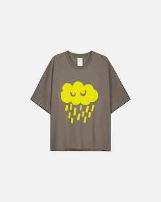 A taupe-brown short-sleeve t-shirt featuring a cartoon graphic of a smiling yellow cloud raining yellow raindrops on the front, displayed against a light gray background.