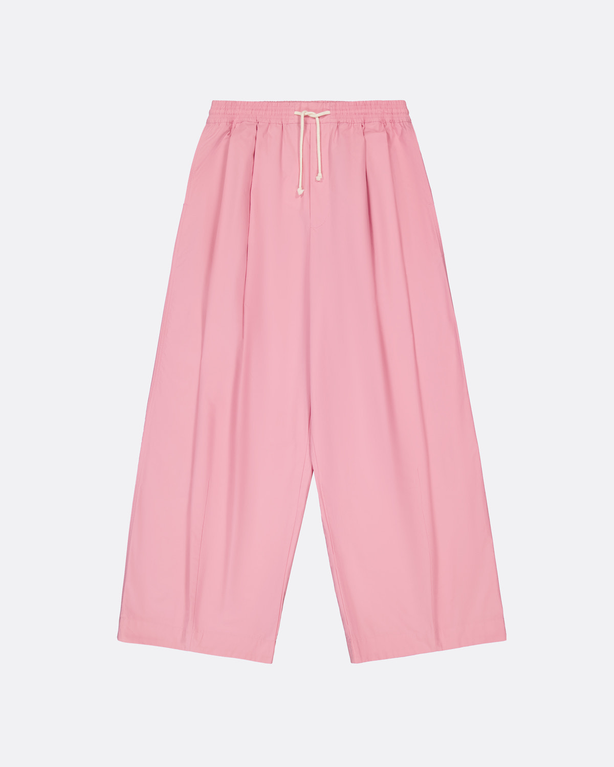A pair of wide-leg, pleated pink pants with an elastic waistband and a white drawstring, shown flat against a light gray background.