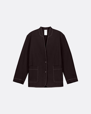 A dark brown cropped jacket with white contrast stitching, featuring a stand collar, button front, and two front patch pockets, displayed on a light gray background.