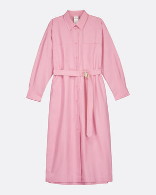 A pink long-sleeve shirt dress with a matching tie belt and a small gold buckle, shown against a plain light gray background.