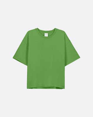 A bright green relaxed boxy t-shirt against a light grey background.