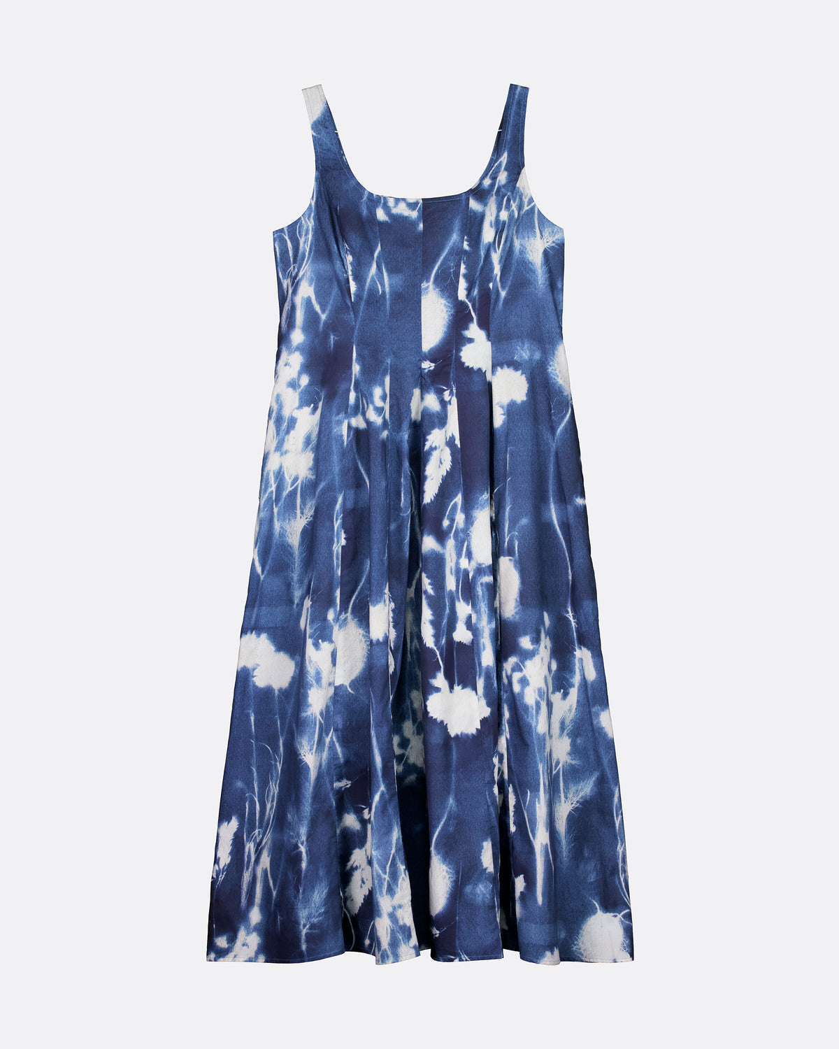 A sleeveless blue and white tie-dye dress with a scoop neckline and thin shoulder straps, shown against a plain light gray background.