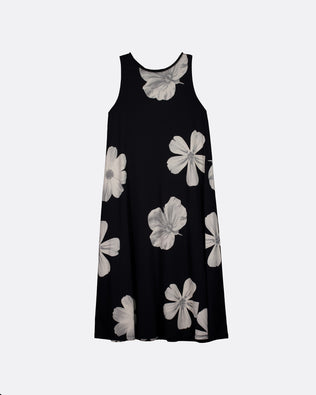 A sleeveless black dress with a large white floral print, displayed against a light gray background.